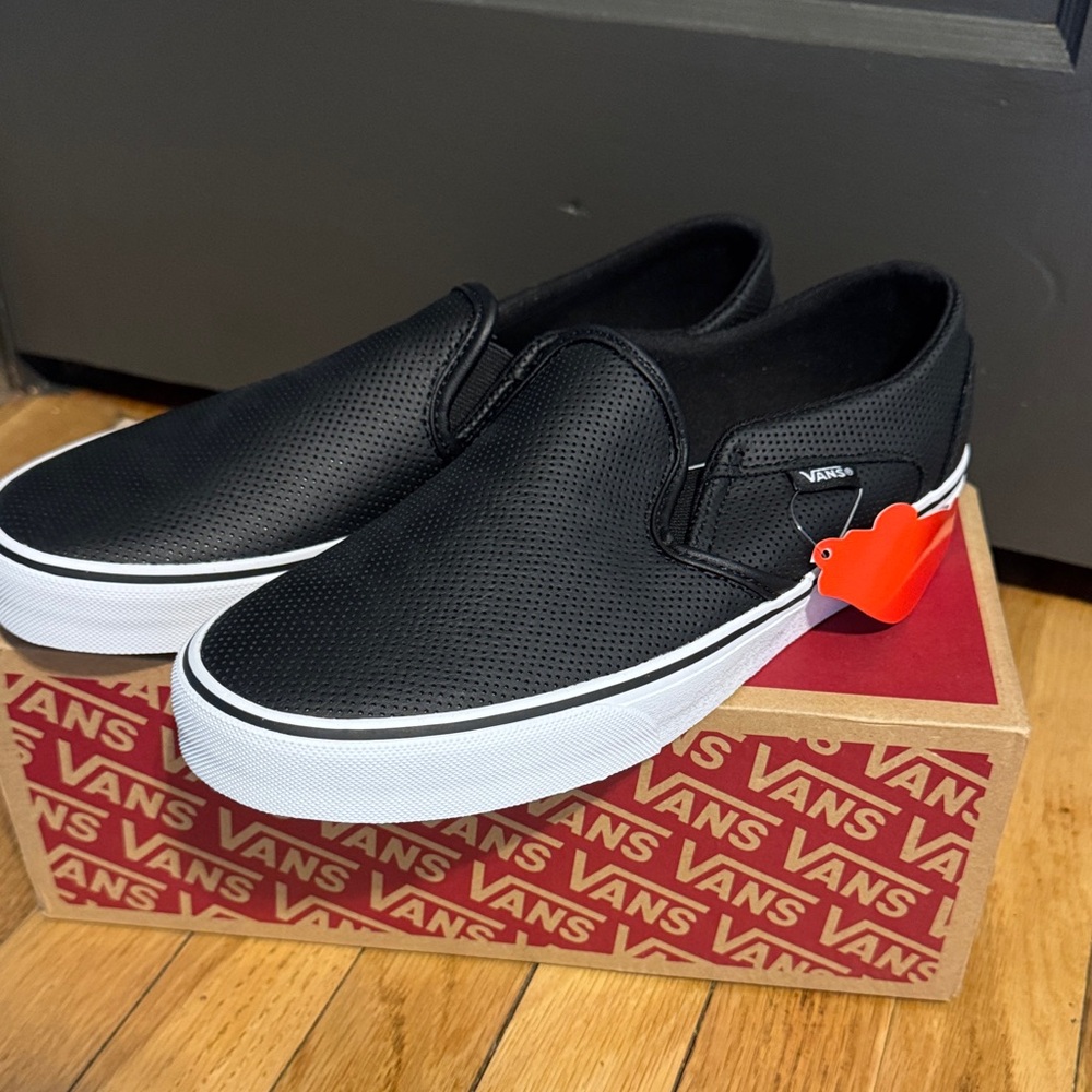 Vans women’s Asher Black Perforated Slip-On Sneakers
